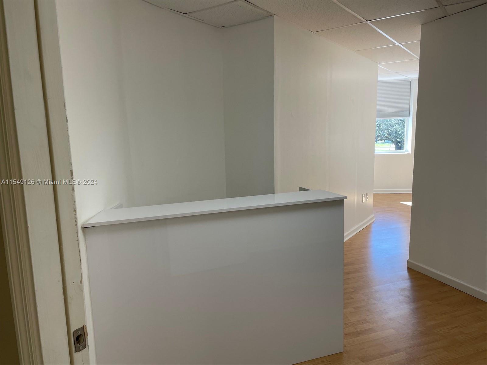 Commercial office space located in the historic Stadnik Building on the circle in Miami Springs. Listed in the National Registry of Historic Places, the building features a restaurant on the 1st floor and offices on the 2nd. The space includes access to common areas, including a furnished and decorated client waiting area and separate men's and women's bathrooms. The unit itself has it's own mini-split A/C. The unit square footage listed is an approximation due to the irregularity of the subject dimensions.