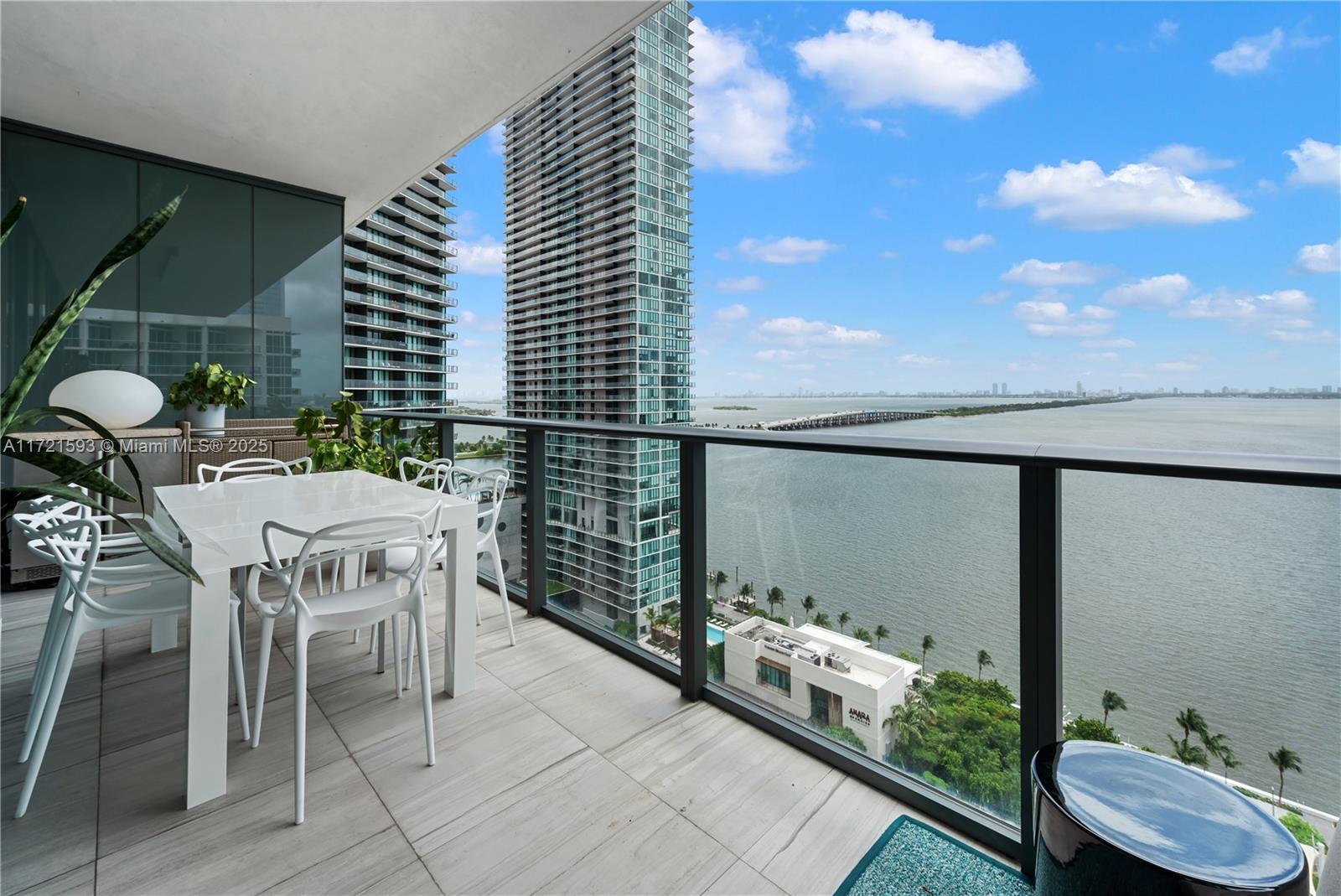 Introducing a truly magnificent and elegant corner unit at Gran Paraiso, offering breathtaking bay and ocean views, complemented by the enchanting cityscape at night. This 4-bedroom, 4.5-bathroom haven boasts wraparound terraces, floor-to-ceiling windows, inviting natural light, and panoramic views. With arrival via private elevator access to 10 foot high ceilings and an open concept floor plan, this residence exudes an air of spaciousness and sophistication. The beautiful Italian kitchen design features high-end appliances including a Sub-Zero refrigerator and velum ceiling with parameter lights. Resort lifestyle, with access to a spa, state-of-the-art fitness center, bowling alley, tennis court, putting green and multiple pools.