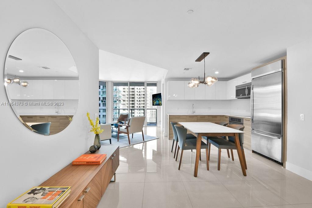 Beautifully finished, move-in ready 2 bed, 2 bathroom condo at Brickell House. This corner unit has breathtaking water views of the Biscayne Bay and enjoys an abundant amount of light. The unit comes equipped with brand new porcelain floors, upgraded high-end finishes, spacious closet space, and newly acquired modern designer furniture. Live the lifestyle and enjoy on-site 24-hour concierge with valet, 7-days a week, a fully equipped fitness center with spa and 2 steam rooms, a children’s playroom, 2 full lap 50-ft pools including one on the 46th floor Sky deck with panoramic views, and so much more to enjoy Brickell living at its very best in this luxurious resort-style community.