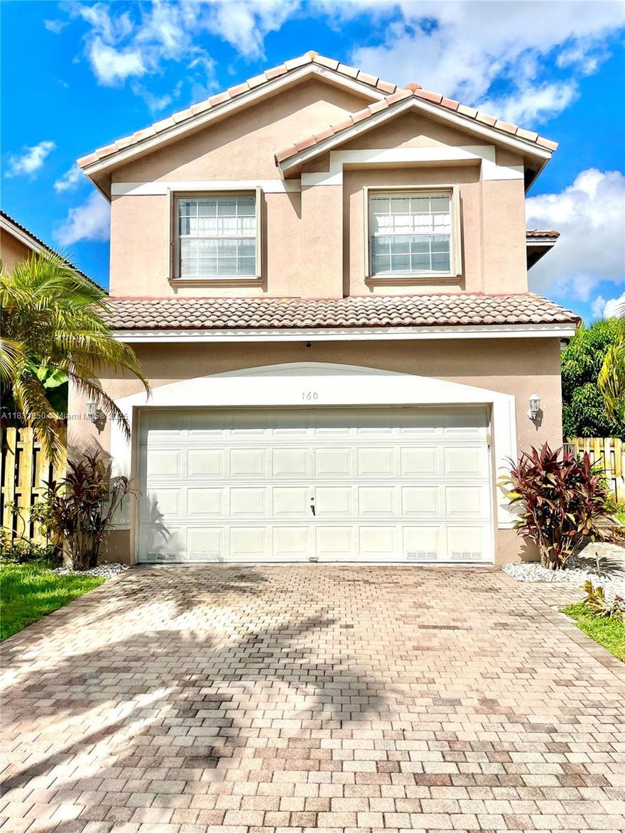 This corner home features large living space and huge fenced backyard. High ceilings, open layout with a huge Living/Family Room and a Dining Room connecting with the kitchen. All 4 bedrooms are upstairs. Master suite has double doors with a large landing that leads to the guest bathroom and other bedrooms. Half bath is conveniently located downstairs. 2-car garage and driveway parking. Close to Sawgrass, Coral Square Mall & Medical Center. Accordion shutters on windows. Mango trees, jackfruit, banana plants & other trees. No worries--lawn care and sprinkler included in rental. Beautiful community pool close by. Unit is vacant, has been professionally cleaned and painted.