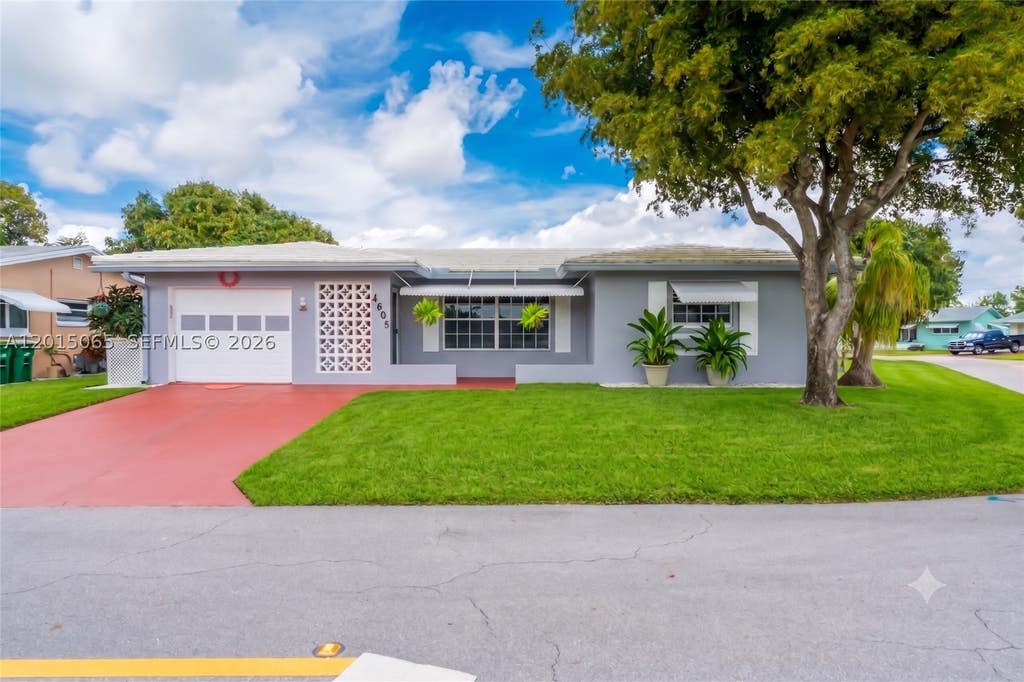 Photo of 4605 NW 47th Ct, Tamarac, FL 33319 (MLS # A12015065)