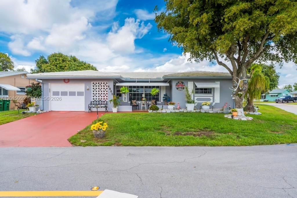 Photo of 4605 NW 47th Ct, Tamarac, FL 33319 (MLS # A12015065)