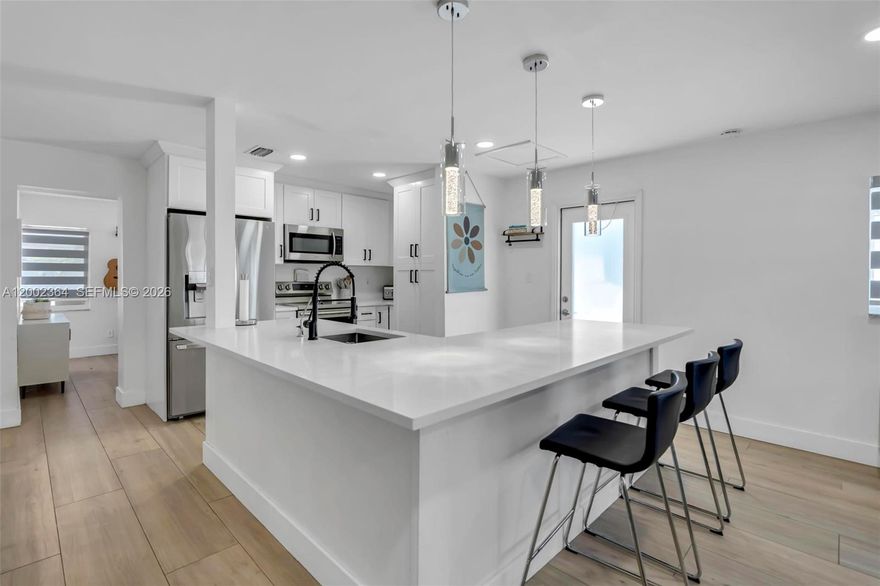 SUPER CUTE and modern 2-bedroom + den (easily used as a 3rd bedroom), 2-bath home loaded with upgrades.
Featuring ALL IMPACT windows and doors! The open-concept kitchen is beautifully updated with quartz countertops, white shaker cabinetry, and stainless steel appliances. Porcelain wood-look tile throughout and fully modernized bathrooms complete with Bluetooth speakers and customizable lighting for a spa-like experience.
Step outside to a private, fenced-in yard with a patio and Sunsetter awning. Additional highlights include modern window treatments, a spacious walk-in closet in the primary suite, and a double-wide driveway with room for up to 4 cars. Large storage shed. Located in a well maintained LOW HOA, pet-friendly community offering two large pools, BBQ areas, a game room, and a rentable party space. Conveniently situated near Sawgrass, walking trails, and Ninja Park—this home truly blends comfort, style, and accessibility.