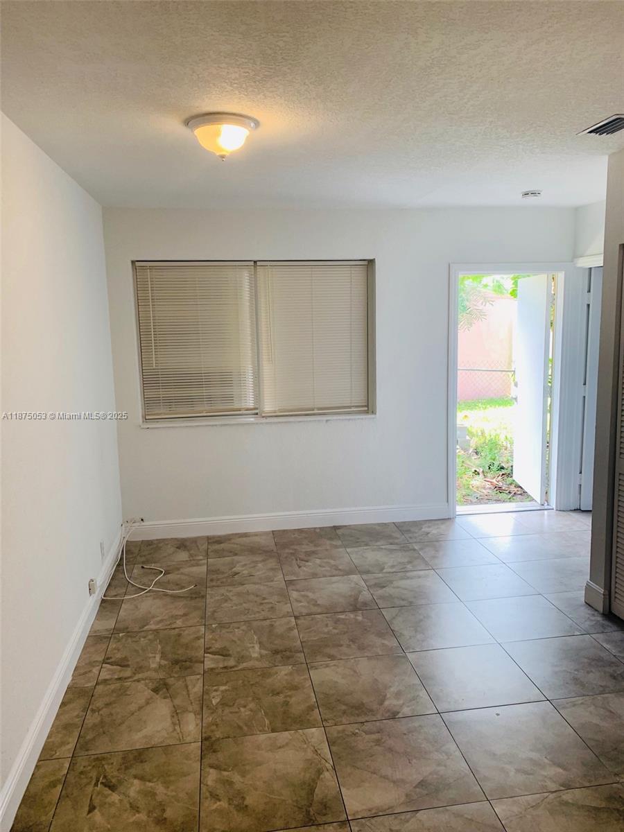 Centrally located turnkey unit just minutes away from I-95 and SR 112. Unit features 2 assigned parking and private yard space. Water is included in the rent price. *** easy to show on supra lock box ***.