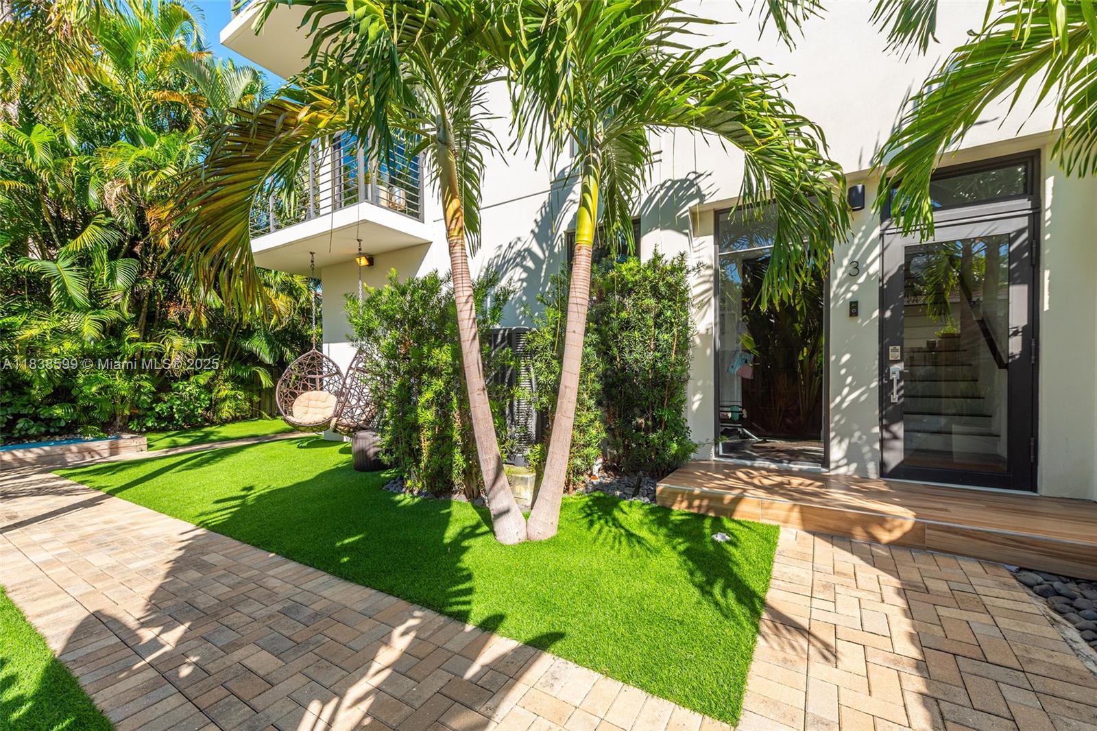 Immaculately updated corner townhome with secure gated access. Sunlit living room and chef’s kitchen with built-in Subzero fridge, Wolfe induction range, and RO water filtration. Private tropical-oasis-inspired yard with astroturf, palm trees and space to relax. Open-concept living with great flow and tons of upgrades: custom glass stair railing, updated lighting, motorized shades, epoxy-coated 2 car garage, pre-wired for Tesla/EV charging, and more. Walk to Holiday Park to watch the Panthers prep for their third Stanley Cup or enjoy tennis, pickleball, and ice skating. Minutes to the beach, Las Olas Blvd’s vibrant dining and boutique shopping, and access to top-rated schools. Priced significantly below recent sales in Victoria Park - this offering won’t last long!