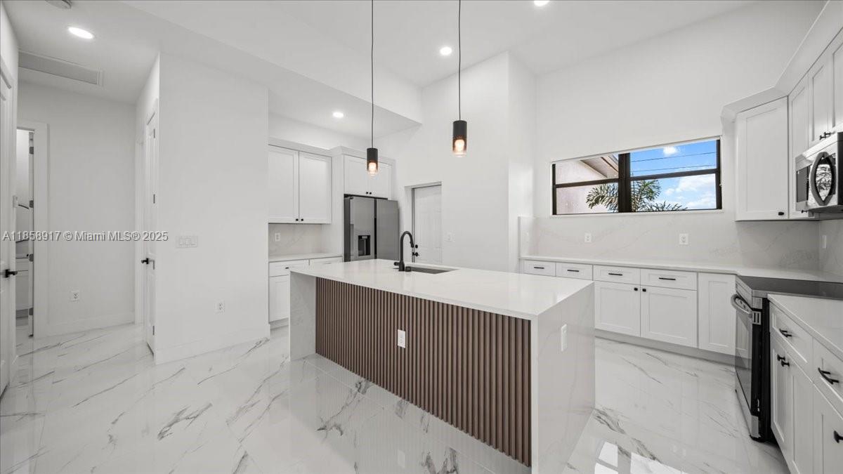 NEW CONSTRUCTION WITH POOL!!. Fenced throughout, this 4-bedroom, 3-bathroom residence offers 1,734 SQFT of living space and 2,568 SQFT of total area!!It features a beautiful saltwater pool with a convenient and spacious outdoor full bathroom, a spacious covered lanai, an outdoor kitchen with a sink and ample countertops with stainless steel cabinetry, a living room with high ceilings and ample space, and beautiful modern tile throughout.It features impact-resistant windows and doors and modern zebra-style window treatments.