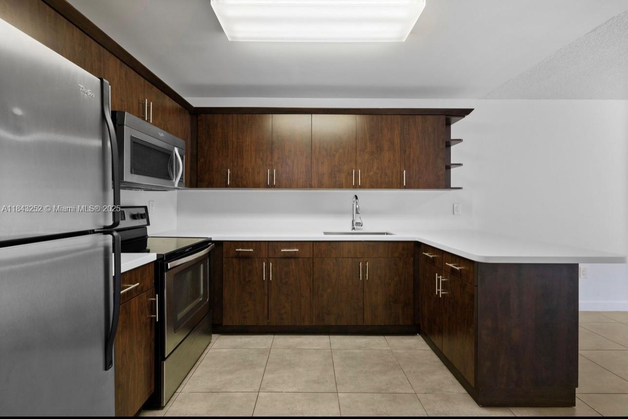 Beautiful and just remodeled big corner apartment on the 3er floor, featuring 2 large balconies, lots of closets and storage space, open kitchen with quartz counter top, New Impact Windows, New AC, new water heater, back outs, ceramic floors. Laundry room on each floor. Centrally located with walking distance to all, close to Shopping Center, Banks, Restaurants, Public Transportation and Major Highways. The well maintain building offers a tennis court, pool, small gym playground, 24 hrs security, on site management. 2 parking spaces (One assigned) Ready to move. FAST APPROVAL