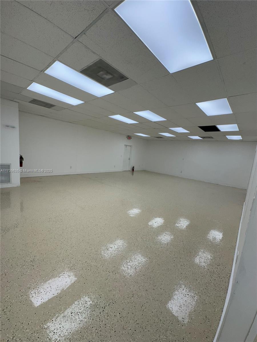 Commercial building with multi-purpose use, industrial, commercial, civic, or educational. Could be used for offices, restaurant facility, bar, warehouse, gym, professional office, many uses! Plenty of exterior parking. Kitchen, bathroom stalls for both men and women. Completely renovated interior, a must see!