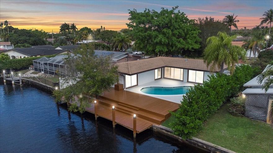 Stunning waterfront property: spacious backyard, lush landscaping, and an inviting pool area. Perfect blend of style! Great Quiet Neighborhood. OCEAN ACCESS WITH FIX BRIDGES. Seller is a licensed realtor agent.