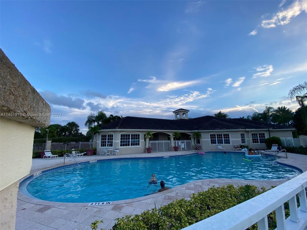 Photo of 5061 Wiles Rd #106, Coconut Creek, FL 33073 (MLS # A11451916)