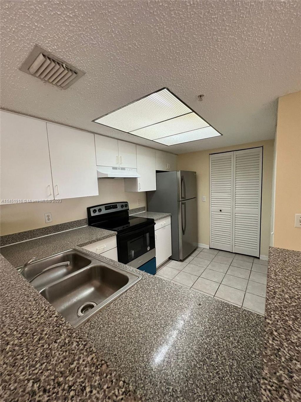 Photo of 5061 Wiles Rd #106, Coconut Creek, FL 33073 (MLS # A11451916)