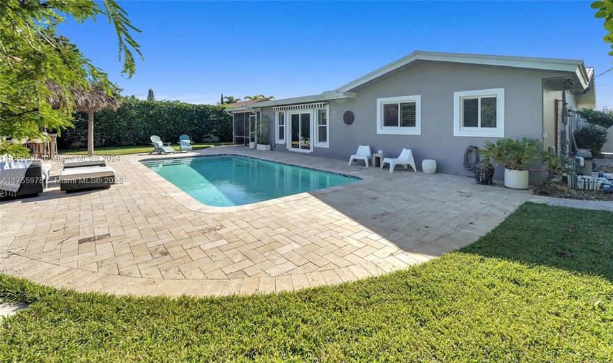 Come discover this charming property located near grocery stores and schools. You'll feel at home, and the garden will enchant you. Peaceful and relaxing, completely private and without overlooking neighbours, you can unwind by the pool and enjoy the tiki hut under a brand-new roof for meals or moments with friends. The house has been redesigned and offers a very pleasant living space. New AC (2024), full impact windows, and impact garage door (two-car space) with metal roof. Just 10 minutes from the ocean! Visits are by appointment only. Call or Text listing Agent.