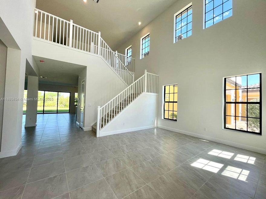 **AMAZING HOUSE IN THE INCREDIBLE PARKLAND BAY COMMUNITY!** Prime Location: Parkland Bay is one of the most exclusive communities in Parkland, offering access to top-rated A-ranked public schools, security, and a family-friendly environment within a natural setting. Excellent clubhouse amenities. New House, Bright, Modern, High Ceilings, Spacious and One Bedroom Suite on the Ground Floor. Many Upgrades. Built in 2022. 5 bed, 5 & 1/2 bath. 3 car garage, gorgeous entrance and garden. 1st floor hall, living room, open kitchen layout with family room, suite, toilette. 2nd floor with family room or office overlooking the stairs, master suite with 2 showers and bathtub.