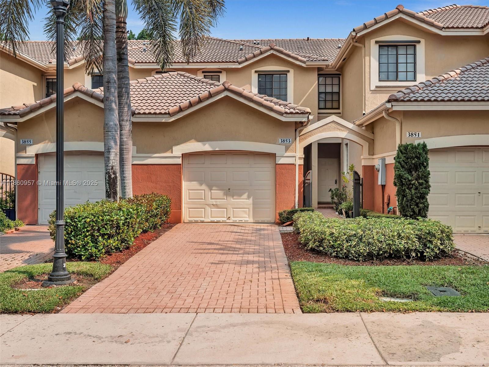 Lovely 2 bed/2.5 bath townhouse set in gated community of Courtyard at the Grove within steps of the community pool and playground. The great room with dining and living areas has marble flooring and opens to a screened and covered patio. The view is of a green area with no neighbors behind. The kitchen has newer appliances and overlooks the great room. Upstairs you will find the master suite with remodeled bathroom boasting marble tile, custom vanity with 2 sinks, roman tub/shower. The second bedroom is split from the primary bedroom and has access to its own full bath. Freshly painted. Don't miss this opportunity to live in a beautiful townhouse in a desirable neighborhood zoned for top notch schools.