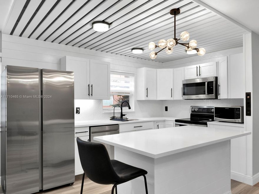 Amazing opportunity with this beautiful ground floor, two bedroom two bath fully remodeled unit in Kings point of Delray. With open floor plan and a lot of natural light, beautiful white shaker cabinets and quartz countertops , new hurricane proof windows and an enclosed balcony with mini kitchen, this unit offers everything you will need in a beautiful community and priced to sell. One of the most active 55 and older communities in Palm Beach County.
