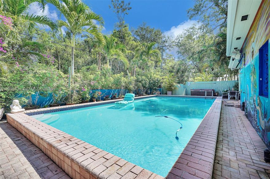 Discover the ultimate Mediterranean-inspired, tropical oasis-feel on the most coveted block of NE 5th Avenue in Miami Shores . This exceptional oversized 3-bedroom, 3-bathroom Living Room AND Family Room residence offers the ideal blend of elegance and comfort, with a thoughtful split-floor plan designed for both entertaining and everyday living. Gather in the expansive formal dining room, unwind in the sun-filled family room that opens directly to the pool deck, and enjoy a truly one-of-a-kind botanical setting filled with exotic plants and fruit trees. With a private well irrigation system, high-capacity climate control, Jacuzzi, CCTV Security System and an oversized heated pool, this estate delivers beauty, function, and year-round enjoyment. Don’t miss the opportunity to make this remarkable property yours.