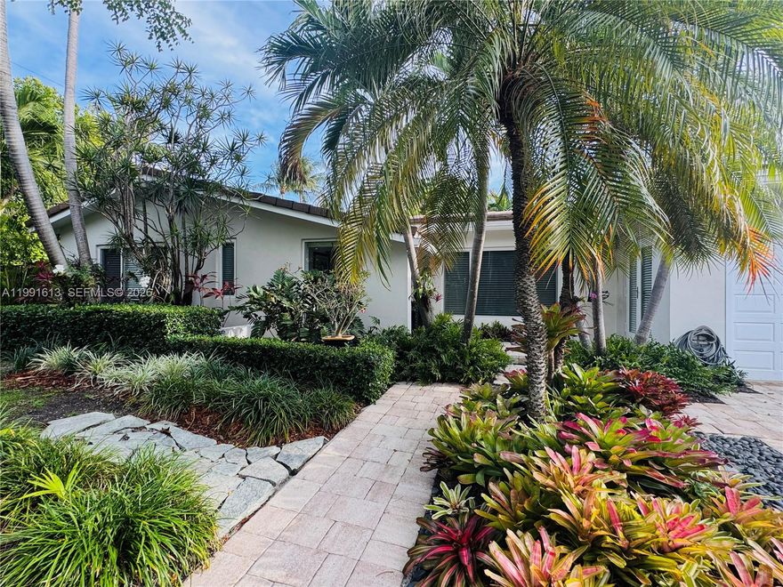 Impeccably maintained 3 bedroom 2 bath residence in the heart of Key Biscayne. This inviting Home features a garage thoughtfully converted into a private office with its own independent entrance ideal for remote work, guest or a studio. Enjoy a Beautiful garden oasis with a sparkling pool and convenient outdoor Shower, perfect for Island living. Moving ready and meticulously cared for, this property offers comfort, functionality, and charm in a prime location. Easy to show. A must see!