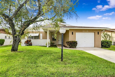 Photo of 6118 Dusenburg Rd, Delray Beach, FL 33484 (MLS # A12106255)