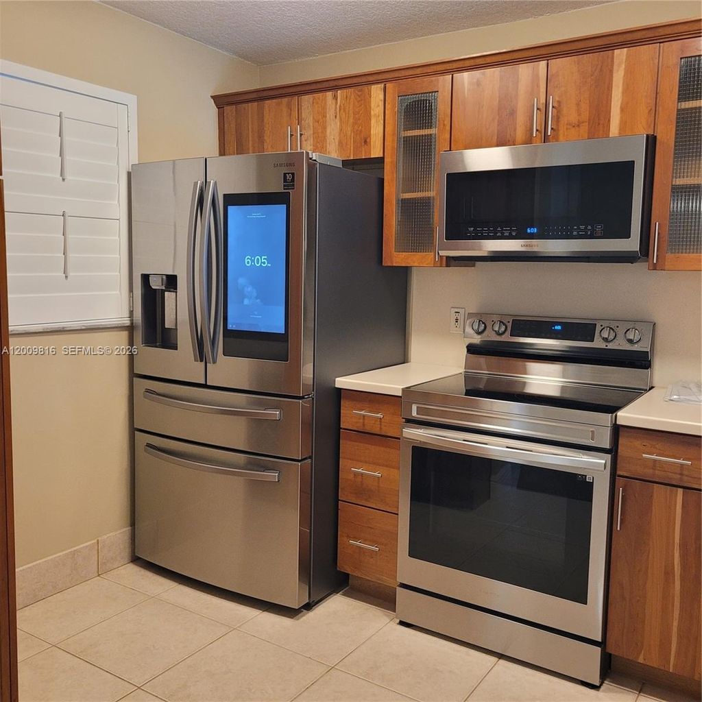 Photo of 1811 Sabal Palm Dr #106, Davie, FL 33324 (MLS # A12009816)