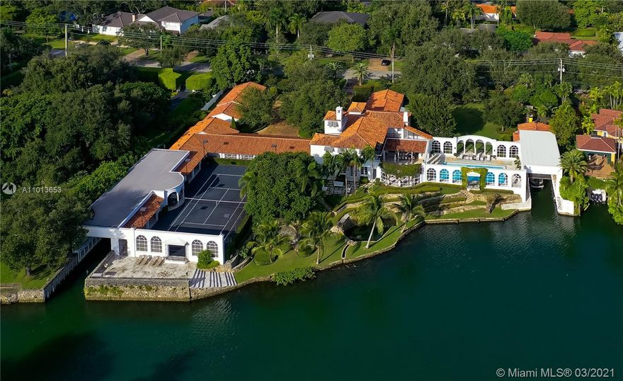 Legendary “Coral Cove” on CG Waterway’s widest point, boasts 212 Waterfront FT, 2 massive Boathouses, Lit Tennis Court, Guest Wing, Spa/Gym, resort Pool & a tidal Pond. Completely & meticulously restored by Mocca Construction in 2012 (gutted, rewired, fortified, expanded) & recently featured in Coral Gables Magazine, the historic 1937 estate was designed in the Mediterranean Revival style of the day by the esteemed firm of Paist & Steward. To preserve its Old World charm, Hollywood glamour & period authenticity, every viable barrel tile, cypress plank & Cuban tile was saved & modern upgrades deftly integrated. The storied residence retains the grace of George Merrick’s Coral Gables but offers the discerning buyer a wealth of contemporary conveniences in a fairytale setting.