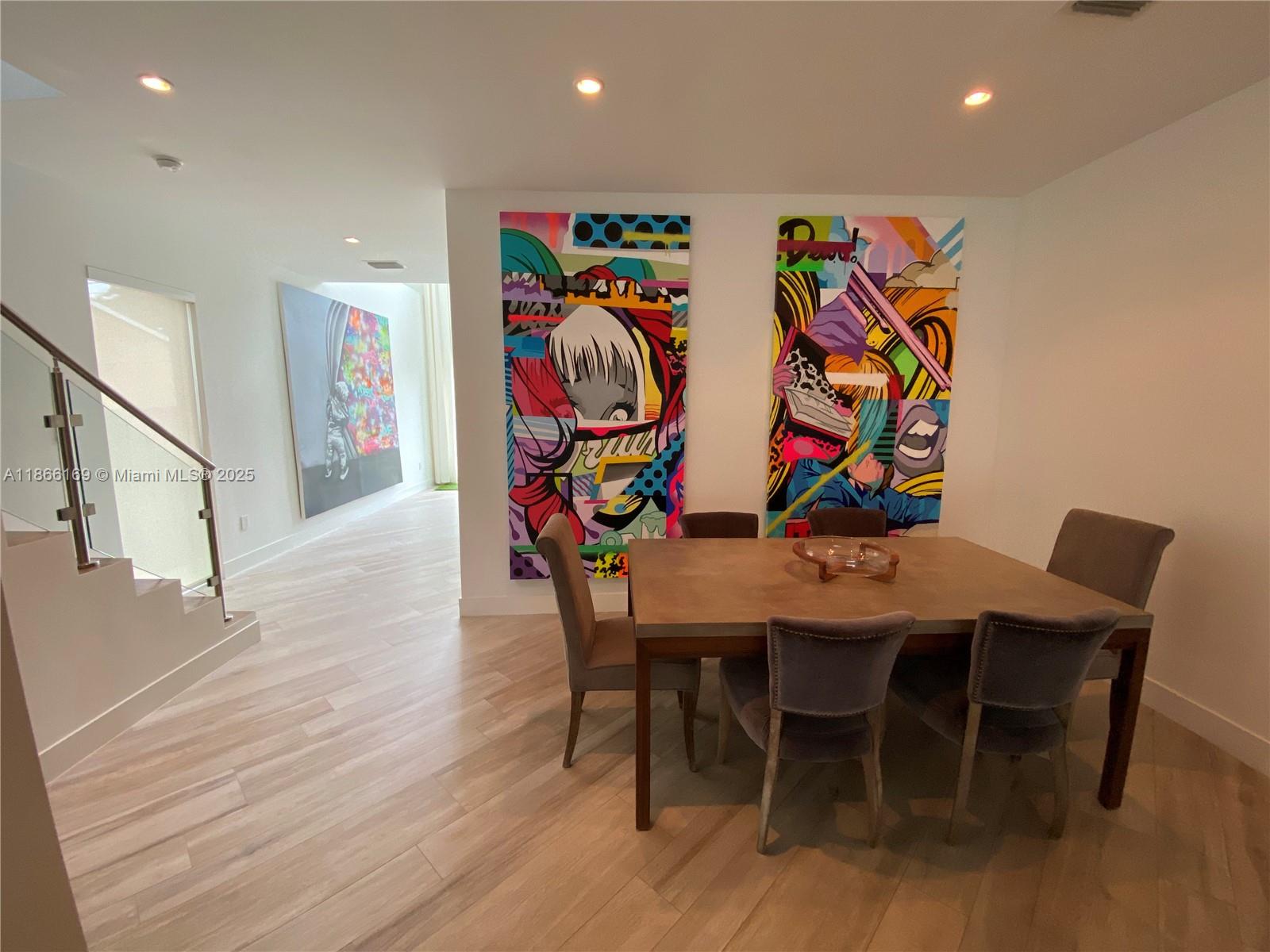 Soaring ceilings, walls of glass, and an open concept create a bright, modern backdrop for Miami living. Centrally located just minutes to Coconut Grove and Coral Gables with quick access to the airport, Miami Beach, Downtown, and Wynwood this stylish residence showcases sleek finishes and stainless-steel appliances. Outside, a private wooden deck turns into your own quiet oasis—perfect for lounging or weekend BBQs. A full garage adds valuable storage and flexibility. Sophisticated, convenient, and move-in ready.