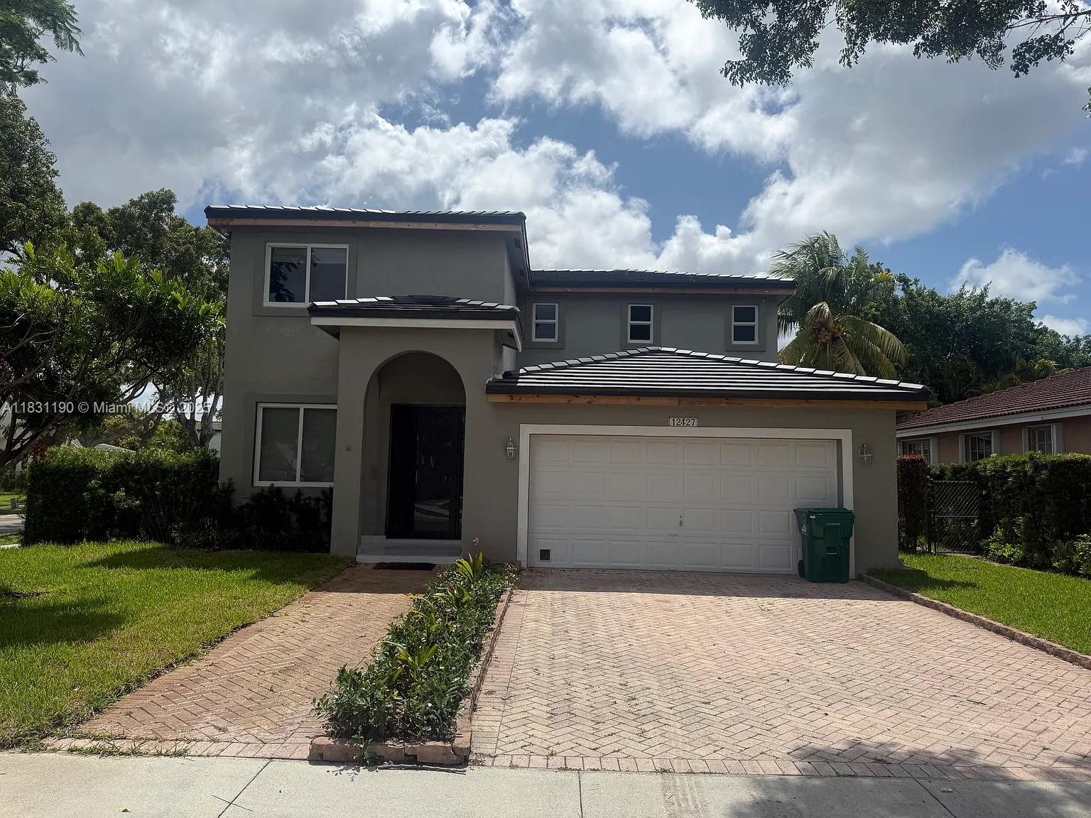 Be the first to call this fully renovated showplace home in the prestigious Gardens Estate community! No detail was spared—this stunning residence features new impact windows, a brand-new roof, fully remodeled bathrooms, and a designer kitchen with island, quartz counters, and all new appliances. The home boasts 48x48 porcelain tile flooring downstairs, warm wood floors upstairs, a refinished private pool, and new central A/C. Enjoy the peace of mind of 24/7 guarded gate access, a 2-car garage, spacious layout filled with natural light, and abundant storage. Conveniently located near Turnpike & 878. Move-in ready luxury with unbeatable location—schedule your showing today!