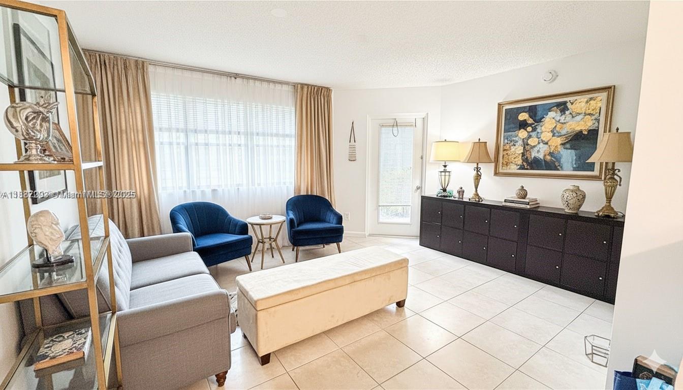 Lovely 1/1 in a pristine, Washer and dryer in property, kitchen with breakfast bar, patio with storage closet at HOLLYWOOD PARC IN HOLLYWOOD! Community with beautiful gardens. 2 community pools along with Tennis courts and a Gym.