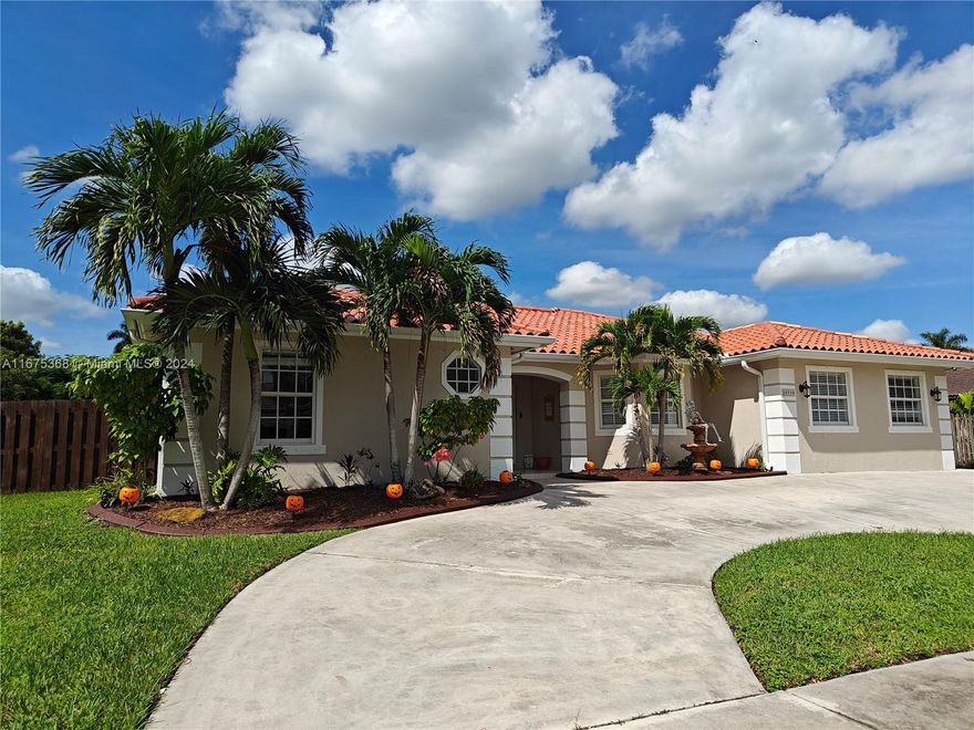 This charming 4-bedroom, 3-bath home near the peaceful Redlands is perfect for multigenerational living. Situated on a ¼ acre corner lot with no HOA or CDD, it offers flexible spaces, including a unique split layout.The home has 3 bedrooms, including a  Master bedroom and 2 baths. The property also features a separate 1-bed, 1-bath in-law suite with its own AC, and kitchenette and cozy living area, perfect for guests or rental income. 
Enjoy the lush yard with lychee, avocado, and mango trees, plus a screened lanai leading to a custom 15x30 pool with jets and water spouts. A tiki hut adds to the outdoor entertainment. 
Don’t miss out!