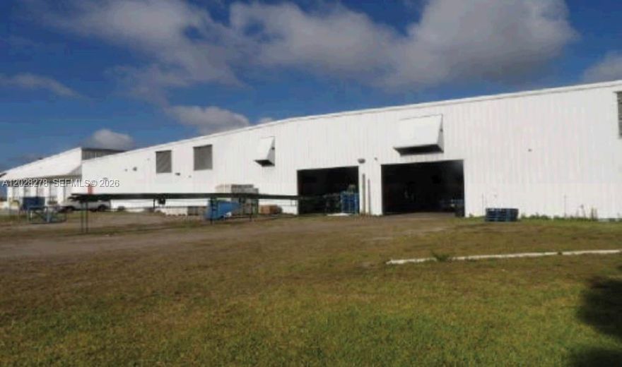 We are delighted to present a 33.14 Acre site perhaps ideal for cold-chain and logistics sectors. Currently used as Packing & Shipping Facility with refrigeration, designed and used for fresh produce. Total 3 folios. Flood Zone X. The Commercial Warehouse is 154,950 SF with concrete and steel construction, metal roof and metal siding. 21,600 SF is enclosed for walking/drive in coolers. The interior has 25' ceiling height and has 2,000 SF of covered/enclosed maintenance area; 6,000 SF covered work area; 18,000 SF of degreening rooms (now utilized for storage); 103,750 SF of packing line and box making area; floor offices and employee break rooms. A portion of the interior is dock height for delivery of products. The 3,600 SF professional office building is CBS construction. Other improvements on site:800 SF Metal Pole Barn, a 784 SF mobile home (2001) and retention pond. Fully fenced campus with 3 gated entries. One Megawatt Power is provided by Glades Electric. Telephone is provided by Embarq. Water & sewage disposal are provided by onsite well and septic systems. Immense storage capacity, cold storage feature, secured campus and rapid logistical turnaround. Facility is located within Hendry Co, Fl with frontage on Hwy 80, which provides direct line to I-75 (leading to Ft Myers and Tampa) and US-27 (leading to Miami or Orlando). In this region of Florida, the primary mode of transportation of goods is via truck. This area is serviced by most major carriers and freight lines.