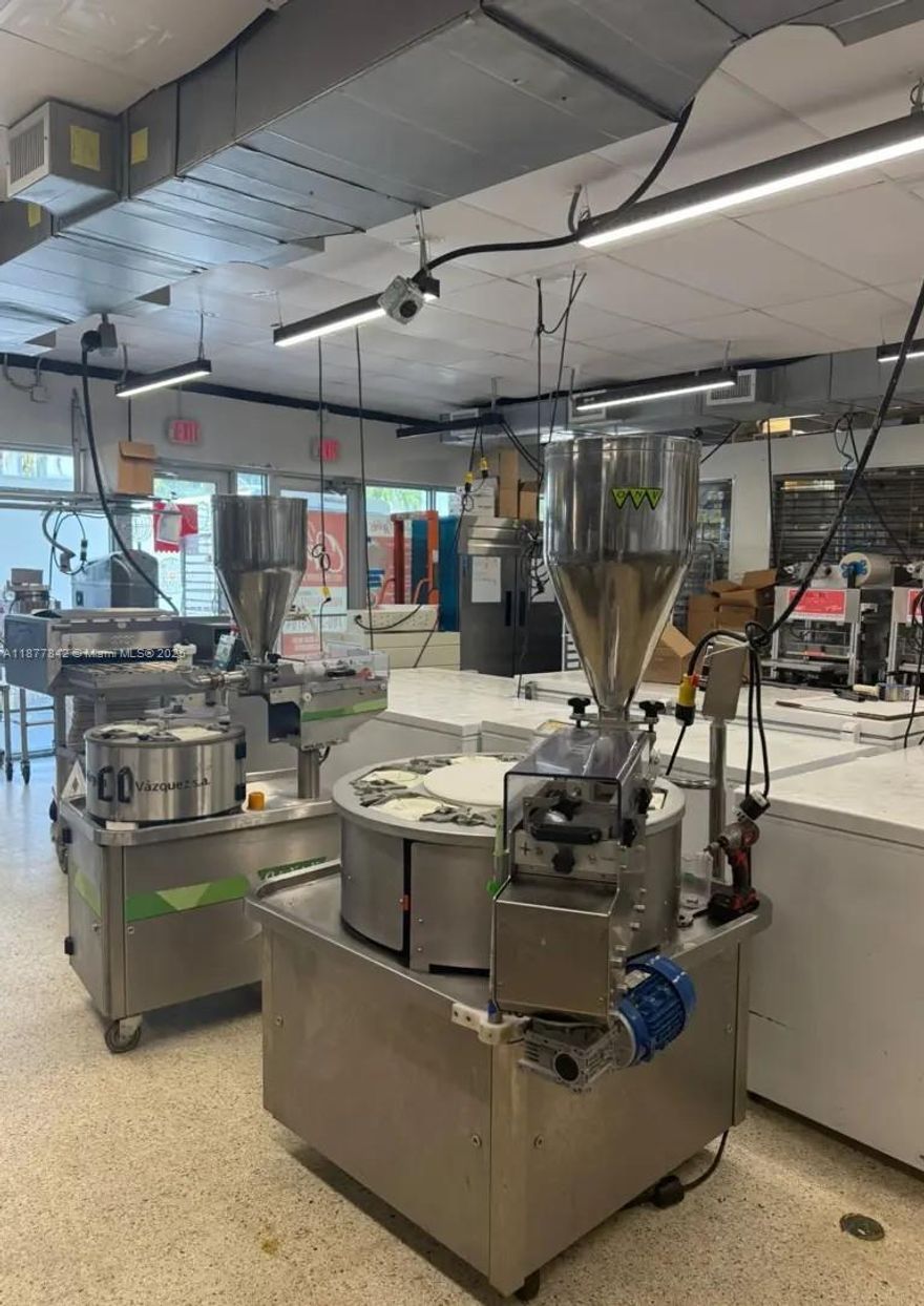 Fully equipped 2,300 sq. ft. empanada production facility in Hallandale Beach, FL. FDA and BCPR approved with all permits, utilities, and high-end equipment in place for immediate use. Includes seating license and optimized workflow for producing fresh, frozen, or vacuum-sealed empanadas. Ideal for co-packing, private-label, or expanding into the wholesale empanada market. Investors get a turnkey setup, avoiding startup costs and delays. Features include gas, electric, ventilation, hood, fire suppression, grease trap, walk-in cooler, new electrical and hot water systems, and 3 large A/C units. Option to convert 1,500 sq. ft. into a restaurant or takeout space.