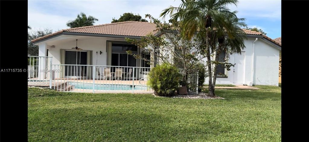 Photo of 4957 NW 111th Ter, Coral Springs, FL 33076 (MLS # A11715735)