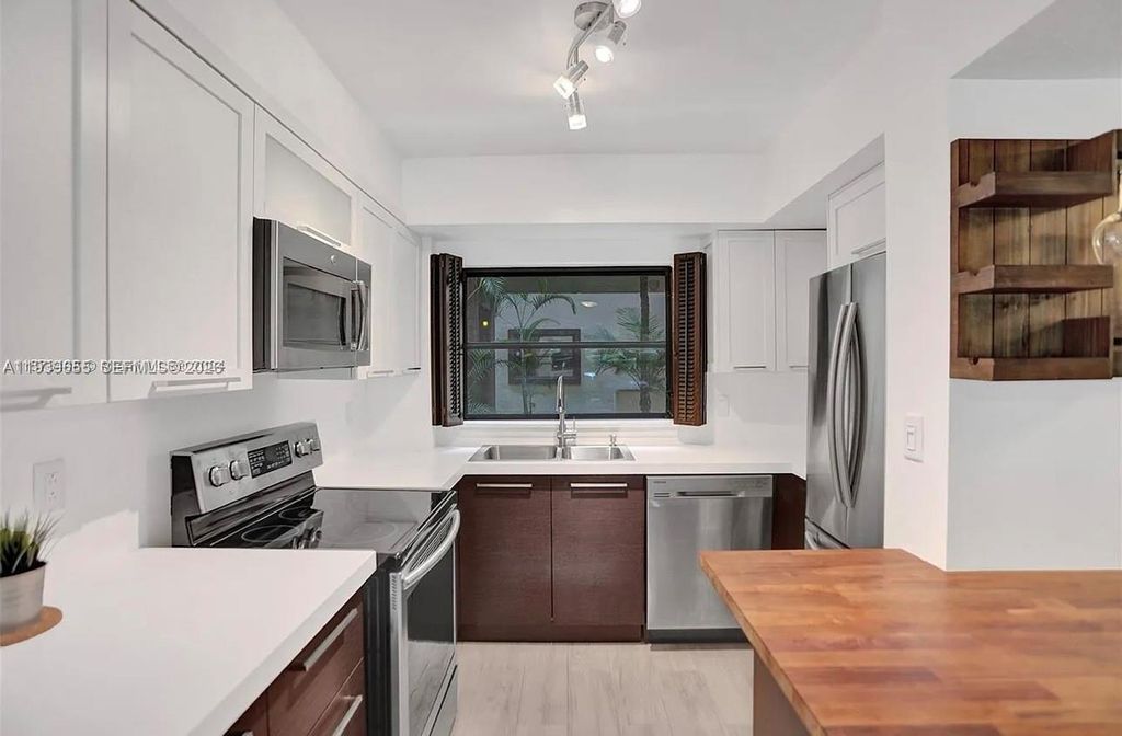 Photo of 6060 S Falls Cir Dr #205, Lauderhill, FL 33319 (MLS # A11939655)