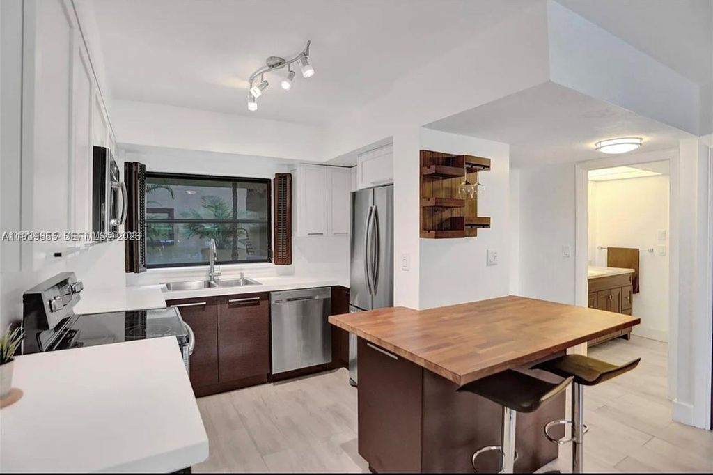 Photo of 6060 S Falls Cir Dr #205, Lauderhill, FL 33319 (MLS # A11939655)