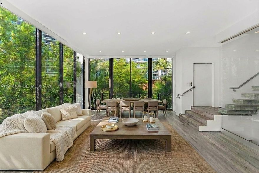 Beautifully designed and built in 2018, this modern townhouse offers three levels of luxury living in the heart of South Beach. The 3-bedroom, 3.5-bath residence spans 2,229 SF and features soaring 11’ ceilings, a private elevator, a floating glass-enclosed staircase, and a 2-car garage. Enjoy a private rooftop oasis complete with a pool and spacious lounging areas. Interior highlights include custom cabinetry and closets throughout, premium appliances and fixtures, a wine fridge, dual ovens, and an in-unit washer and dryer. The primary suite features dual vanities and a separate soaking tub and shower. Ideally located just a short walk to the beach, Pura Vida, Sunset Harbour, Lincoln Road, and top dining and restaurants. An exceptional home offering privacy, comfort, and contemporary sophistication.