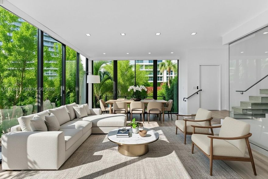 Beautifully designed and built in 2018, this modern townhouse offers three levels of luxury living in the heart of South Beach. The 3-bedroom, 3.5-bath residence spans 2,229 SF and features soaring 11’ ceilings, a private elevator, a floating glass-enclosed staircase, and a 2-car garage. Enjoy a private rooftop oasis complete with a pool and spacious lounging areas. Interior highlights include custom cabinetry and closets throughout, premium appliances and fixtures, a wine fridge, dual ovens, and an in-unit washer and dryer. The primary suite features dual vanities and a separate soaking tub and shower. Ideally located just a short walk to the beach, Pura Vida, Sunset Harbour, Lincoln Road, and top dining and restaurants. An exceptional home offering privacy, comfort, and contemporary sophistication.