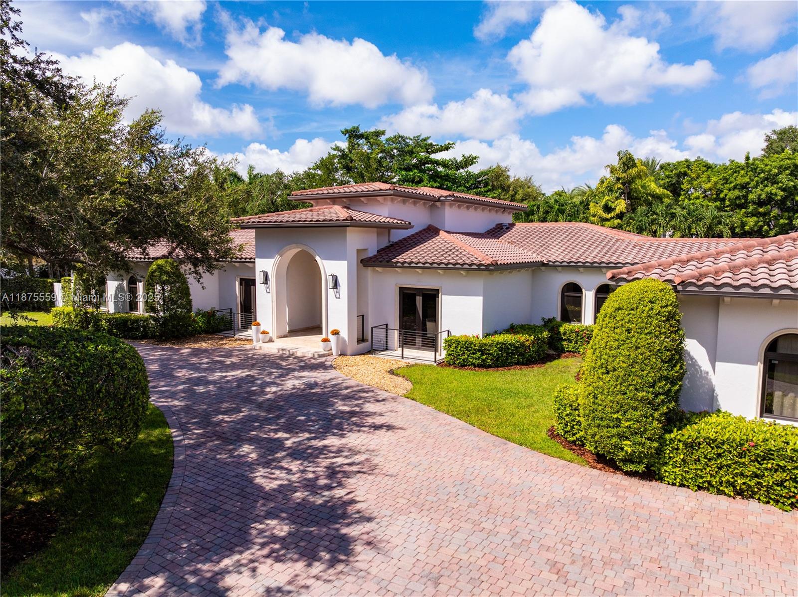 On a quiet, tree-lined street in NE Pinecrest, this 6 bedroom estate, plus home office, is designed for making memories. Behind the gates, a sweeping driveway welcomes you. Inside, soaring ceilings with wood beams & elegant marble floors set the stage for everyday moments & special celebrations. The new chef’s kitchen, with a 48” Viking 6-burner gas range, 3 ovens, & coffee bar invites connection, while a 1000+bottle, temperature controlled wine room awaits to toast life’s milestones. Outside, the backyard is made for fun: covered terrace, Argentinian BBQ, summer kitchen, renovated pool, putting green, basketball half-court, & playground. With a whole-house generator, impact glass, surround sound & an air-conditioned 3 car garage, comfort is always part of the story. A Very Special Home.