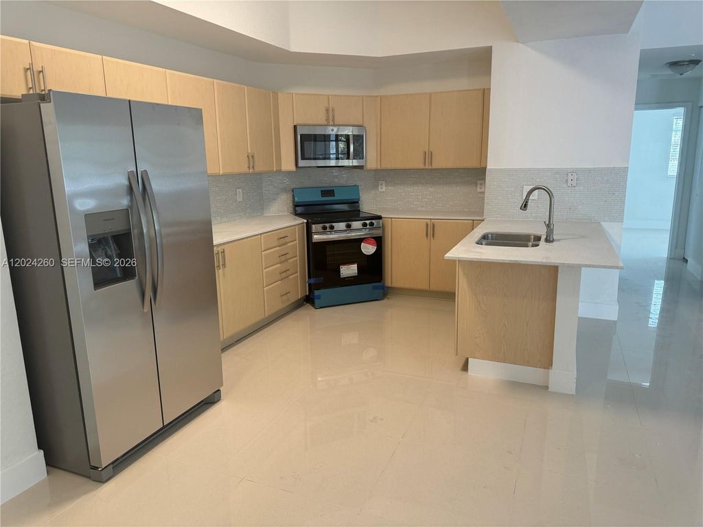 Photo of 2851 Riverside Dr #205-N, Coral Springs, FL 33065 (MLS # A12024260)