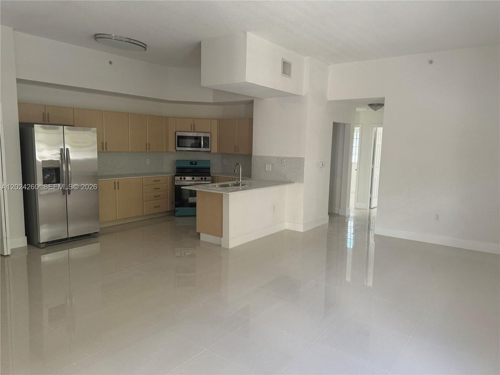 Photo of 2851 Riverside Dr #205-N, Coral Springs, FL 33065 (MLS # A12024260)