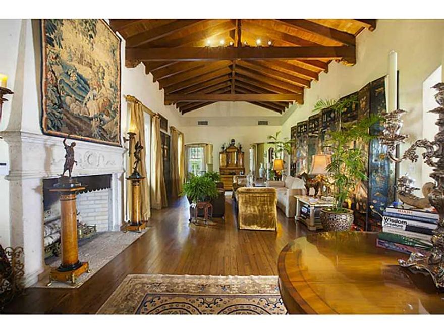 This elegant 3br/3ba Mediterranean oasis features lush landscaping, grand ceilings and opulent architectural details throughout. Begin your journey past the stunning original solid wood doors towards the wood burning fireplace located in the formal living  area and make your way outside to the Keystone trimmed pool with Chicago brick flooring. The property includes a beautiful cabana which can be used as a guest house featuring ample built in closets or an office, den/media room.