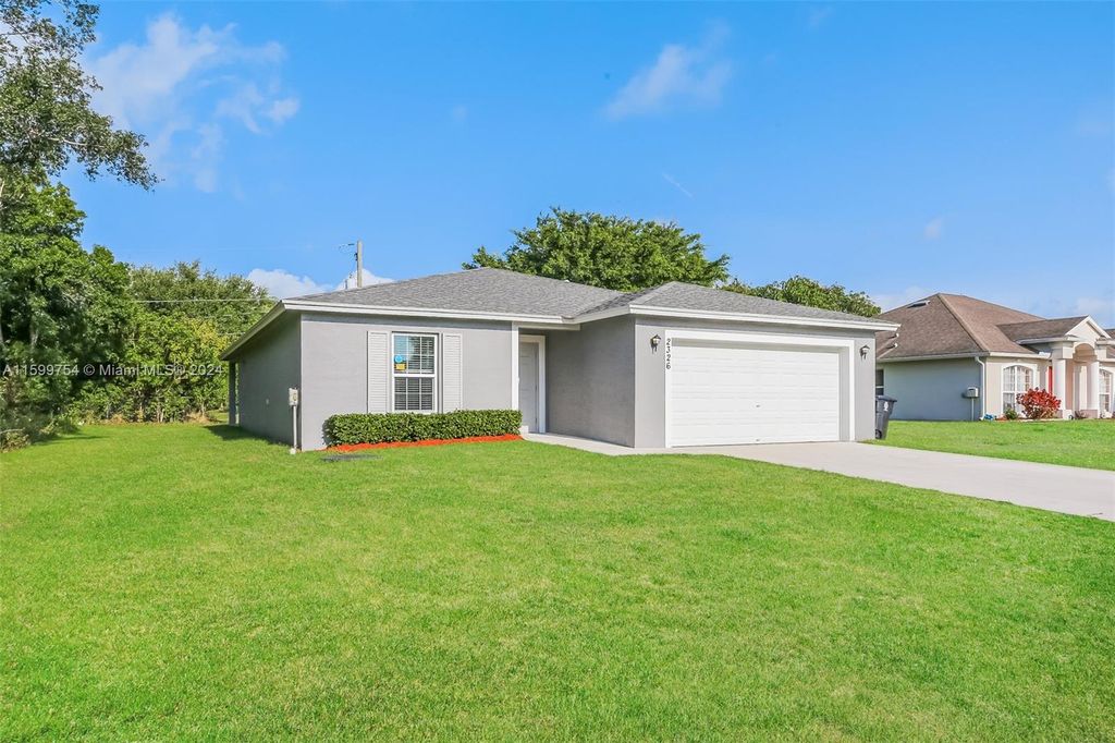 Photo of 2326 SW Freeman St, Port Saint Lucie, FL 34953 (MLS # A11599754)