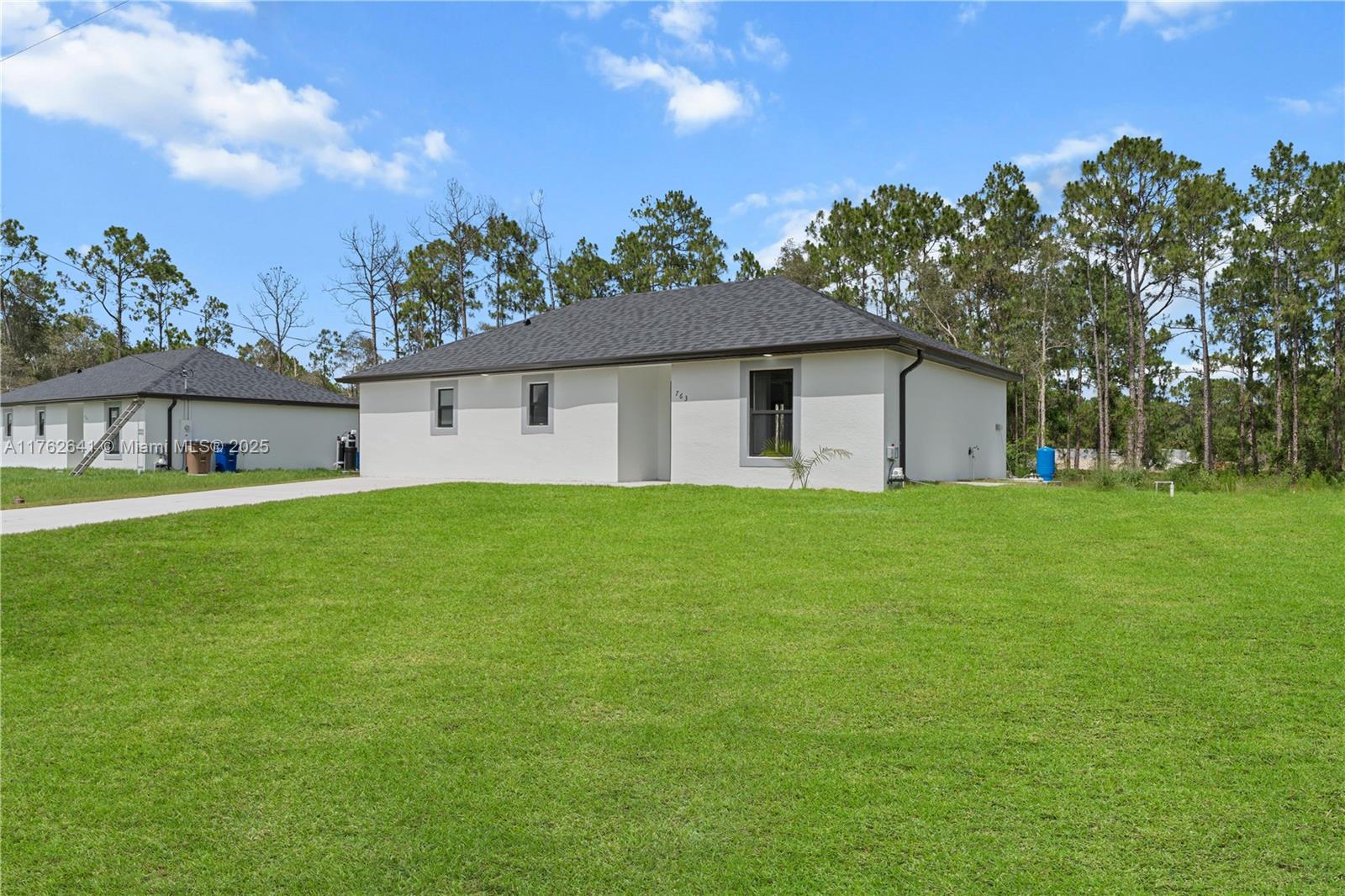 NEW CONSTRUCTION***Ready to move in***Beautiful 3 bedrooms, 2 bathrooms, new construction home located in a fast growing area in Lehigh Acres. This home has an open floor plan, high ceilings, porcelain tile floors throughout the entire home, stainless steel appliances, impact windows and doors. Beautiful white cabinets and quartz counter tops. Schedule your showing today and come see this beautiful home!