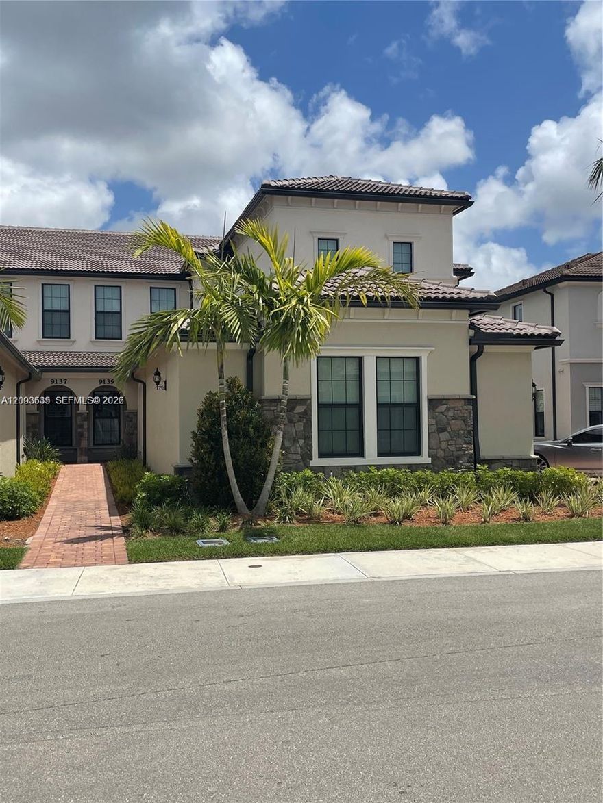 Lavish 3 bedroom, 2 bath home just built in 2021 with your own personal elevator.  Home is like new with a separate office or possible 4th bedroom. Located in Boca Flores adult community. Gorgeous chef's kitchen with large island, overlooking family room. SS appliances and large pantry. Wood-like tile flooring, Impact windows and doors. Large screen balcony with private views. There is a two car garage and dedicated charger installed for your vehicle. Lovely laundry room with full size washer & dryer with plenty of cabinets & counter tops.   Man-gated community with resort style pool which is only few homes down. Property is furnished or could rent unfurnished.