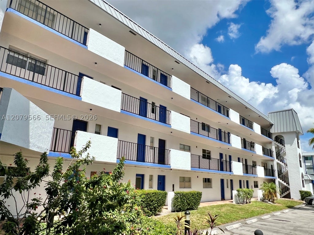 Photo of 6300 S Falls Cir Dr #408, Lauderhill, FL 33319 (MLS # A12079566)