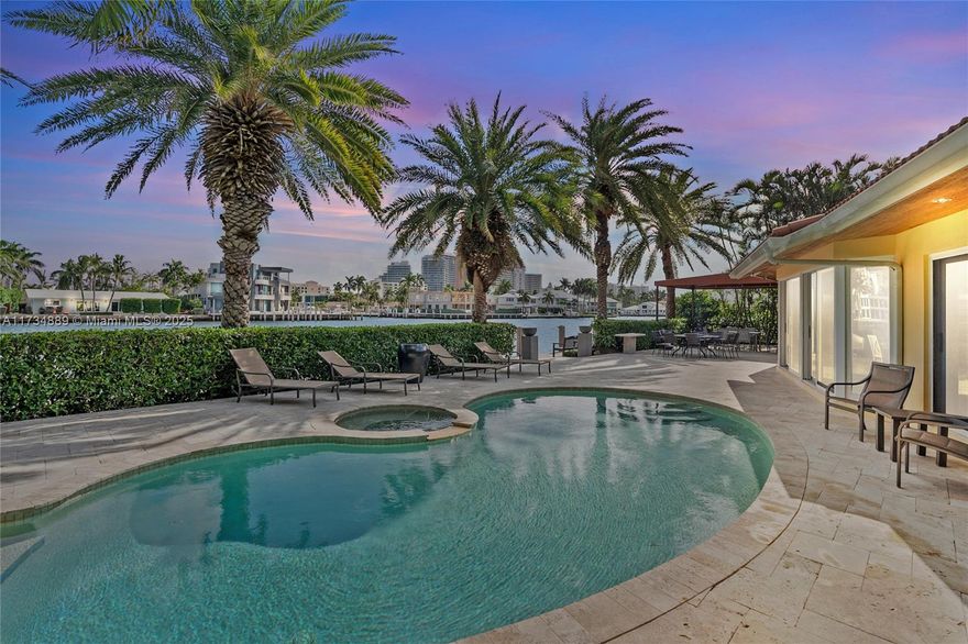 This stunning 3-bedroom, 2-bathroom home offers 110 feet of direct Intracoastal frontage in sought-after Coral Ridge. Spanning over 2,500 sq. ft., including a two-car garage, it features continuous sliding glass doors that showcase breathtaking water views. The gourmet kitchen and open-concept living space, adorned with marble floors, create an entertainer’s dream. Lush tropical landscaping ensures privacy for the heated pool and spa, while the primary suite boasts a spa-like bath and custom dressing room. A private dock with unrestricted ocean access makes this a rare find. Minutes from world-class shopping, dining, and beaches, this home offers an exceptional waterfront lifestyle. Don't miss this rare direct intracoastal front opportunity -schedule your private showing today.