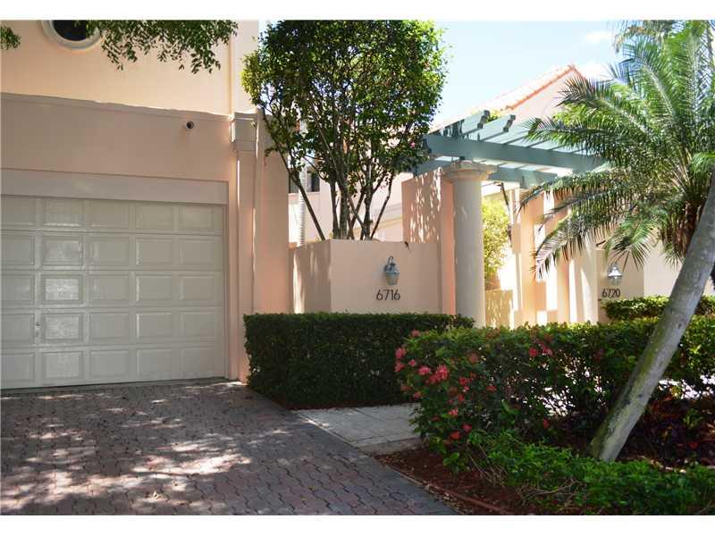 Rarely available! Affluent life-style in this engaging 2 story, 4bed/3bath townhome in Swan Lake, an upscale gated community of luxury townhomes in Pinecrest Large living spaces, soaring ceilings, 4 bed/3bath (one bedr/1bath on first floor); updated kitc hen and bathrooms, sun room, gourmet kitchen, indoor laundry, marble baths, lots of storage space, master suite with large balcony and marble bath, and 2 car garage. Roof was just replaced. HOA fees include insurance, 24 hr. sec. guard, heated pool