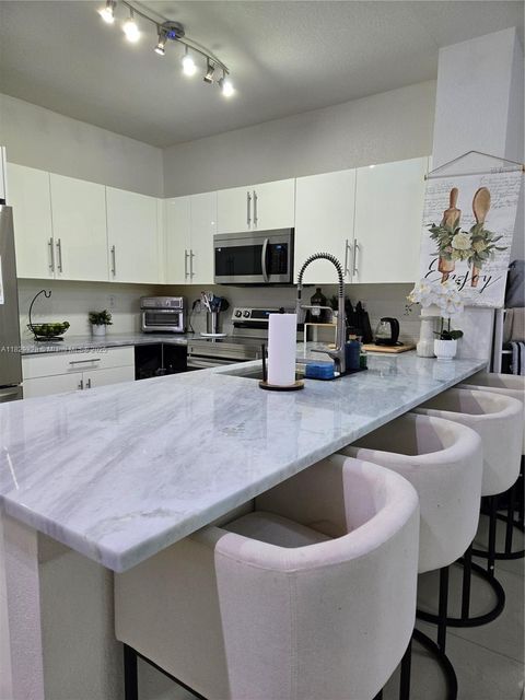 Photo of 8216 W Santa Monica Ave, Tamarac, FL 33321 (MLS # A11829828)