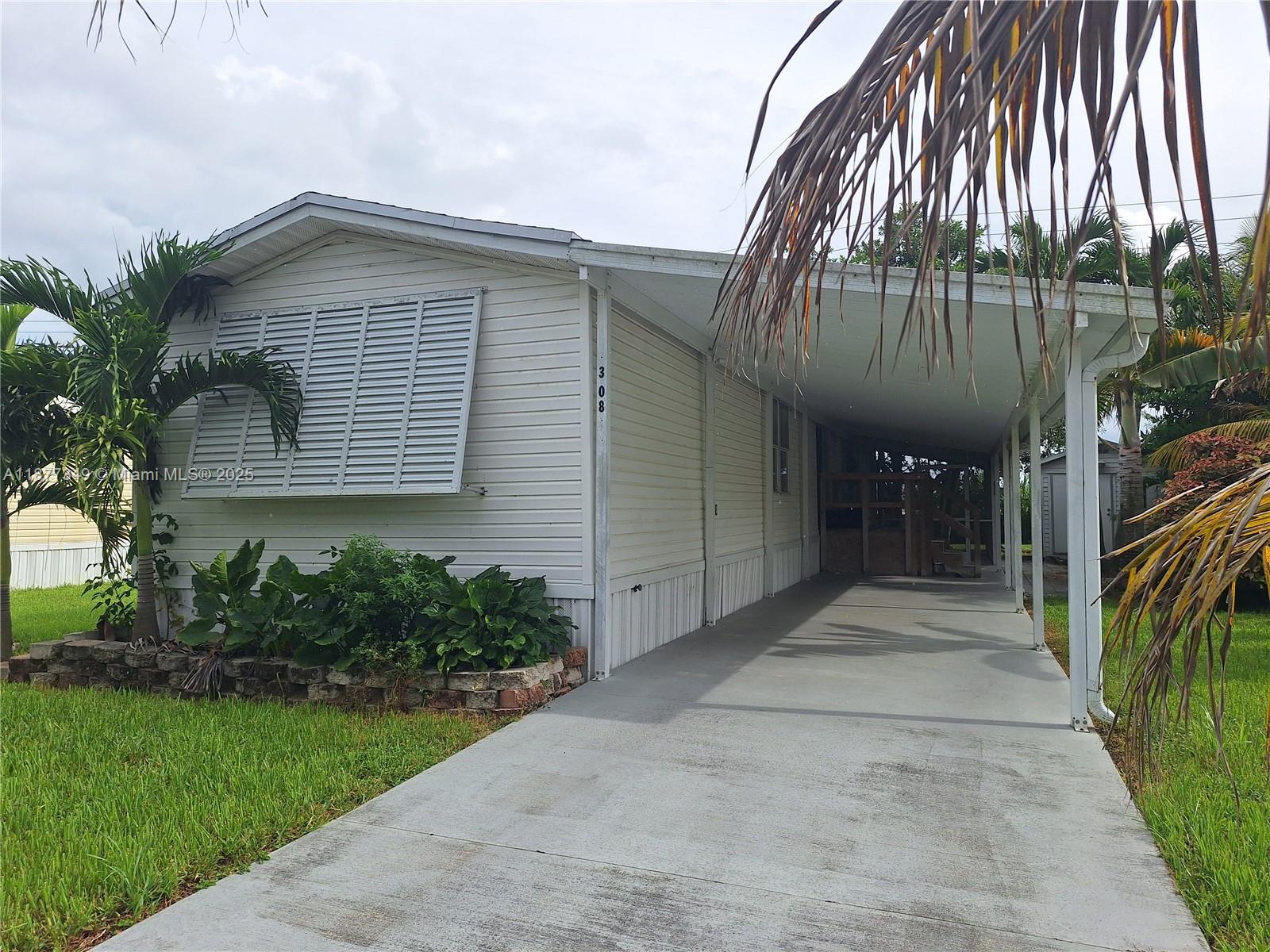 THIS IS AN ADULT 55+ COMMUNITY, OTHER OCCUPANTS CAN'T BE UNDER 18.IN MOVE IN CONDITIONS, A SINGLE WIDE MANUFACTURED HOMES WITH 2 BEDROOMS AND 2 FULL BATHS, CERAMIC TILE FLOORS IN MAIN AREAS, WOOD FLOORS IN BEDROOMS, SPLIT PLAN, LAUNDRY ROOM WITH WASHER AND DRYER IN UNIT. SCREENED PORCH, LARGE STORAGE SHED, FENCED BACKYARD, CEMENT SLAB PARKING. IT HAS A CLUBHOUSE WITH HEATED POOL THE ENTIRE YEAR, A NEW GYM AVAILABLE FOR ALL RESIDENTS. HOA APPROVAL IS REQUIRED PRIOR TO MOVE IN. THIS COMMUNITY IS CENTRALLY LOCATED IN THE HOMESTEAD/FLORIDA CITY AREA, MINUTES AWAY FROM THE SOUTH DIXIE HWY, FROM THE FLA. TURNPIKE, THE FLA. KEYS, SHOPPING CENTERS, HOSPITAL, BISCAYNE BAYFRONT PARK, AND MUCH MORE.