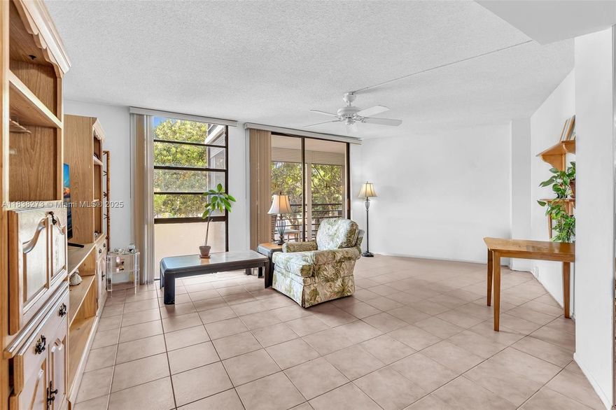 Fantastic opportunity to own this highly sought-after 2 bedroom 2 bath corner unit in beautiful Biscaya! Bring your personal style & turn this super BRIGHT and spacious SECOND FLOOR unit into your own gem. Enjoy an abundance of natural light, oversized windows, an alcove in Living room - for extra living space, plus a desirable split-bdrm layout. The private, bright & generous sized master bdrm incl. 2 windows, closets galore, a vanity area & bath. Enjoy a bright comfortable size eat-in kitchen w/a window, plus an awesome dining area that overlooks the large wrap around balcony. This beloved 55 PLUS gated community is pristine & PERFECTLY situated on Aventura's fabulous 3 mile circle. Meet new friends, visit the beach & nearby Aventura mall. A/C  2 years old plus 4 ceiling fans throughout.