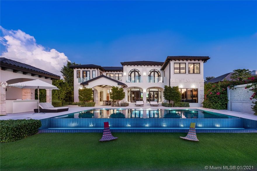 Completely remodeled, transitional-style waterfront mansion located on Lower North Bay Rd – Miami Beach’s most prestigious address for ultra-luxury real estate. Combining elements of modern & classic to create a seamless balance between both worlds, this luxe home offers expansive living areas, including a grand room with dramatic double-height ceilings with a glass roof, game room, waterfront living & family room, chef’s kitchen, & dining with a wine cellar. Lavish master suite, 3 large beds, striking windows, Crestron system, soaring ceilings, & modern edgy details mark the interiors of the main house. Pool deck with a resort-style pool, spa, & patio - ideal for entertaining & enjoying views of Sunset Lake. 2/2 guesthouse - 1 bed converted into gym, 3-car garage, large dock, 100-FT WF.