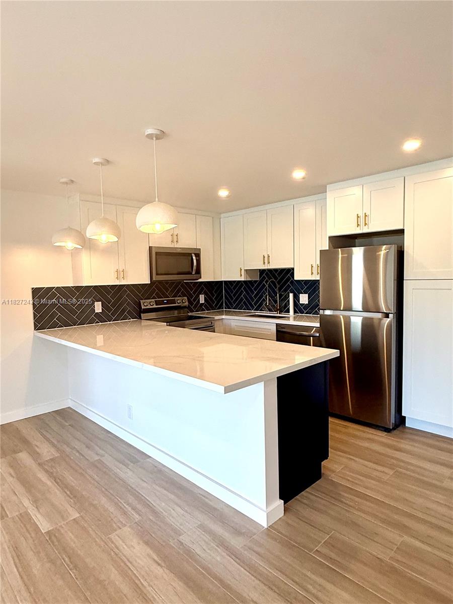 Completely remodeled 2-bedroom, 2-bath unit featuring a brand-new kitchen with stainless steel appliances, new flooring throughout, and a separate laundry room. Located in a gated community just minutes from downtown West Palm Beach, and beaches. Move-in ready and perfectly situated for convenience and comfort!